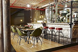 This coffee shop features a number of reclaimed timber elements. Photo/design: Haldane Martin/Flickr