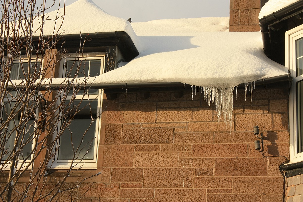 How to Safely Clear Snow Off a Roof Networx