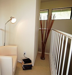 A small indoor balcony space is cleverly staged as a reading nook. Note the sleek little club chair. (Photo: jdeeringdavis/Flickr Creative Commons)