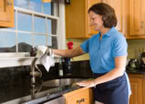 woman cleaning kitchen
