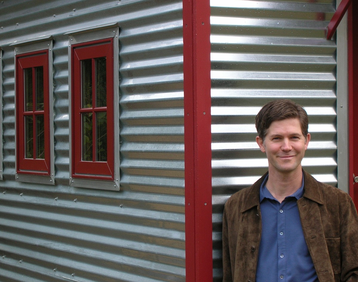 Jay Shafer in front of one of his designs. Photo by Janine Borgenson. Used with permission from Tumbleweed Tiny House Company.