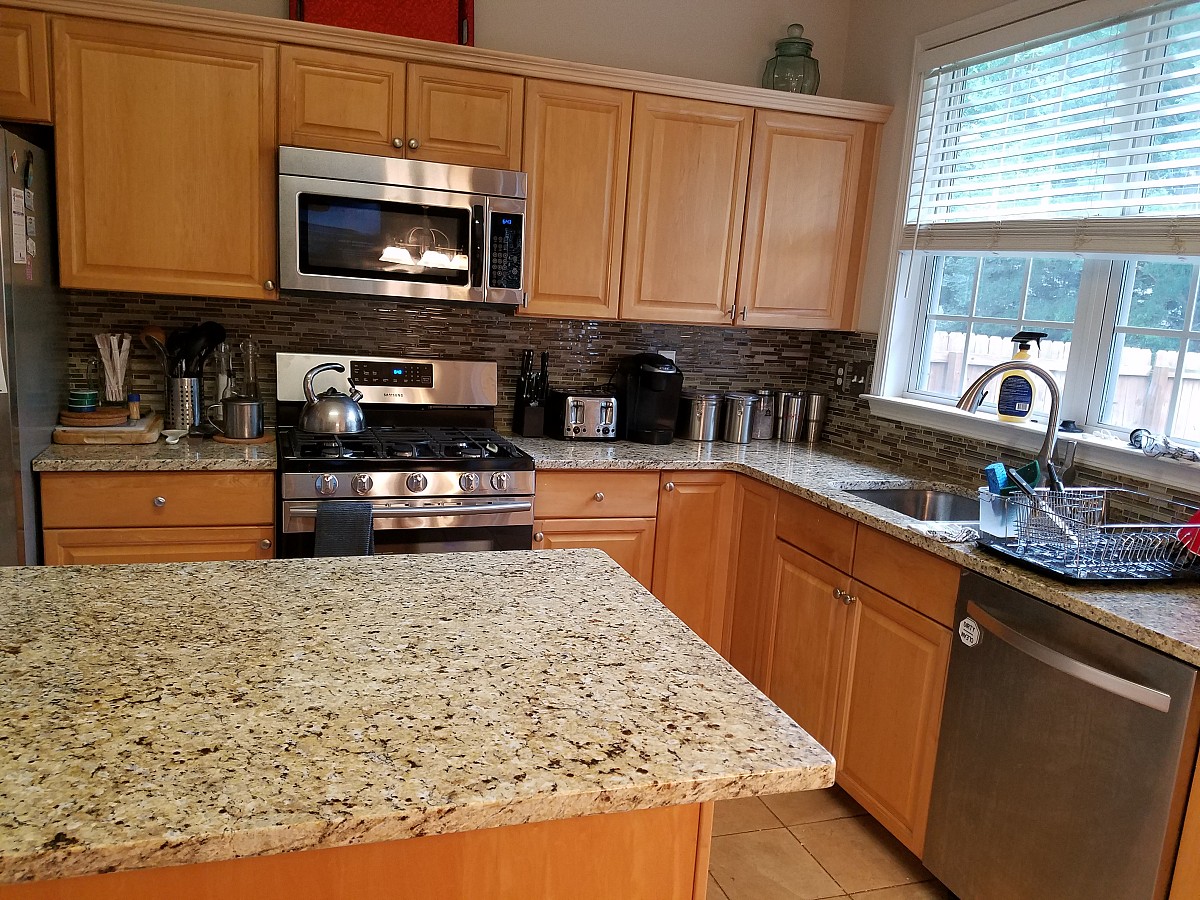 Backsplash installation matches new counters
