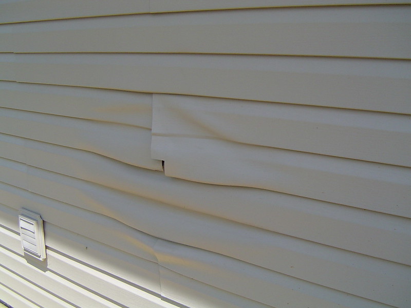 Damaged siding  Ryan Frost / flickr   