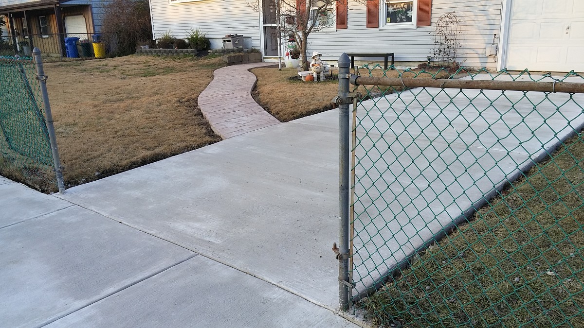New concrete driveway, sidewalk and walkway